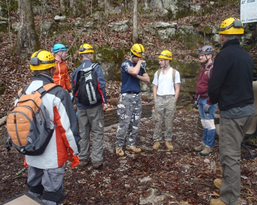 Geared up, we gather outside the cave.